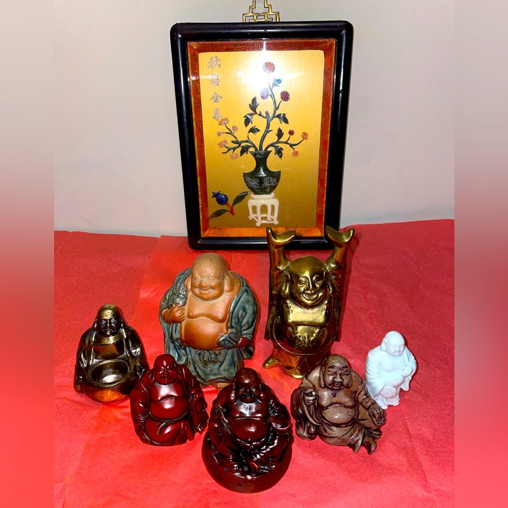 7 authentic  Buddha figurines that came from various places around the world